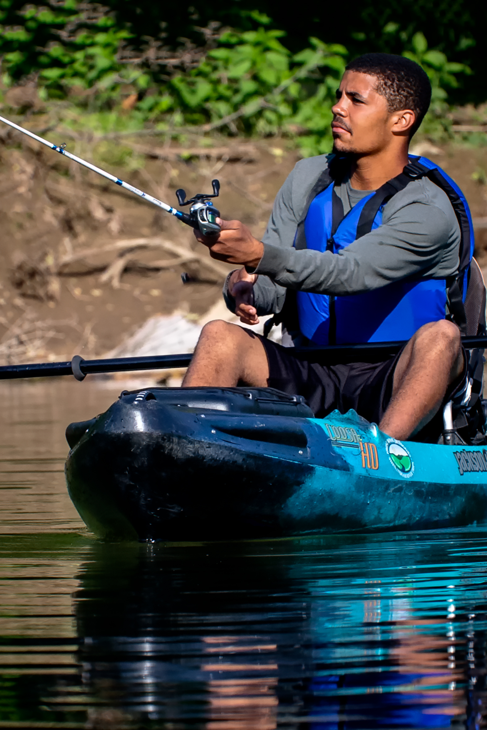 a man fishing in a kayak