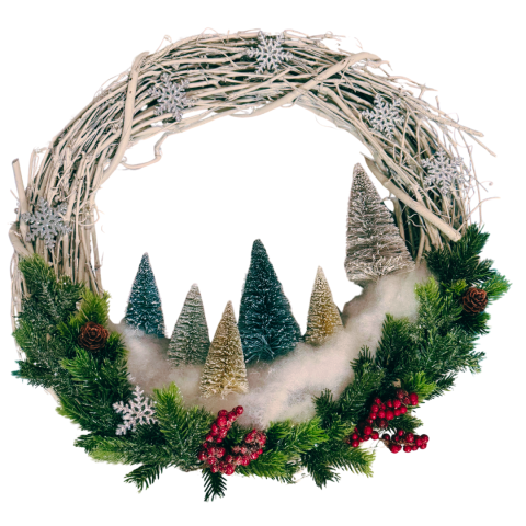 Photo of a grapevine wreath decorated with bottlebrush trees, fake snow, and greenery.