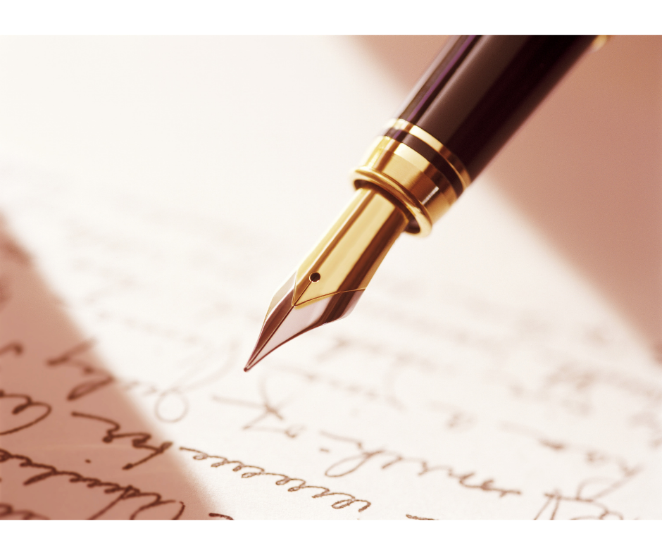 A pen hovering over a page of writing