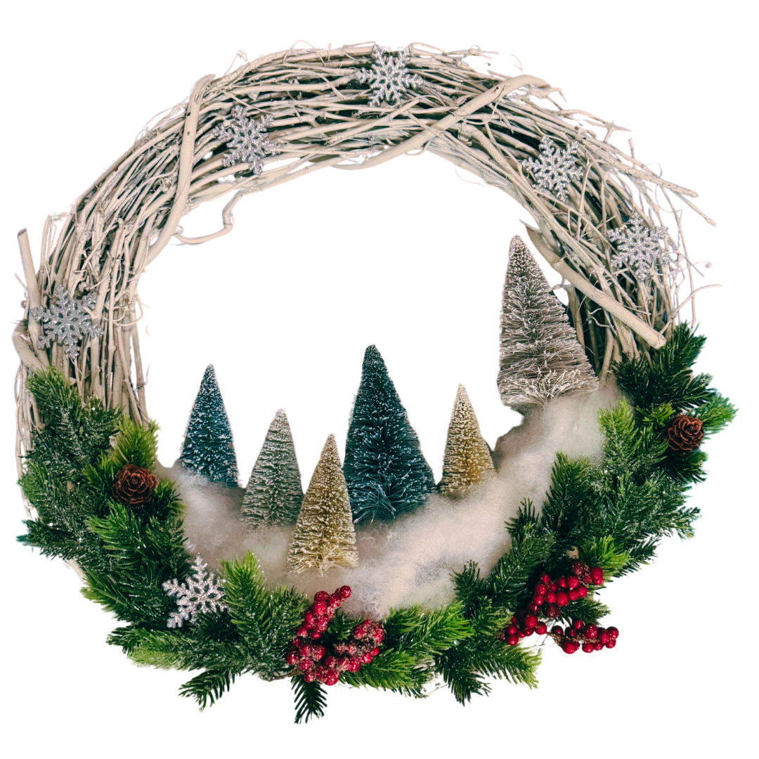 Photo of a grapevine wreath decorated with bottlebrush trees, fake snow, and greenery.